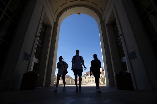 Students silhouetted in the archway between Marion and Clark halls in TCU's Worth Hills. Photographed Thursday, March 21, 2019. (AP Photo/Jeffrey McWhorter)