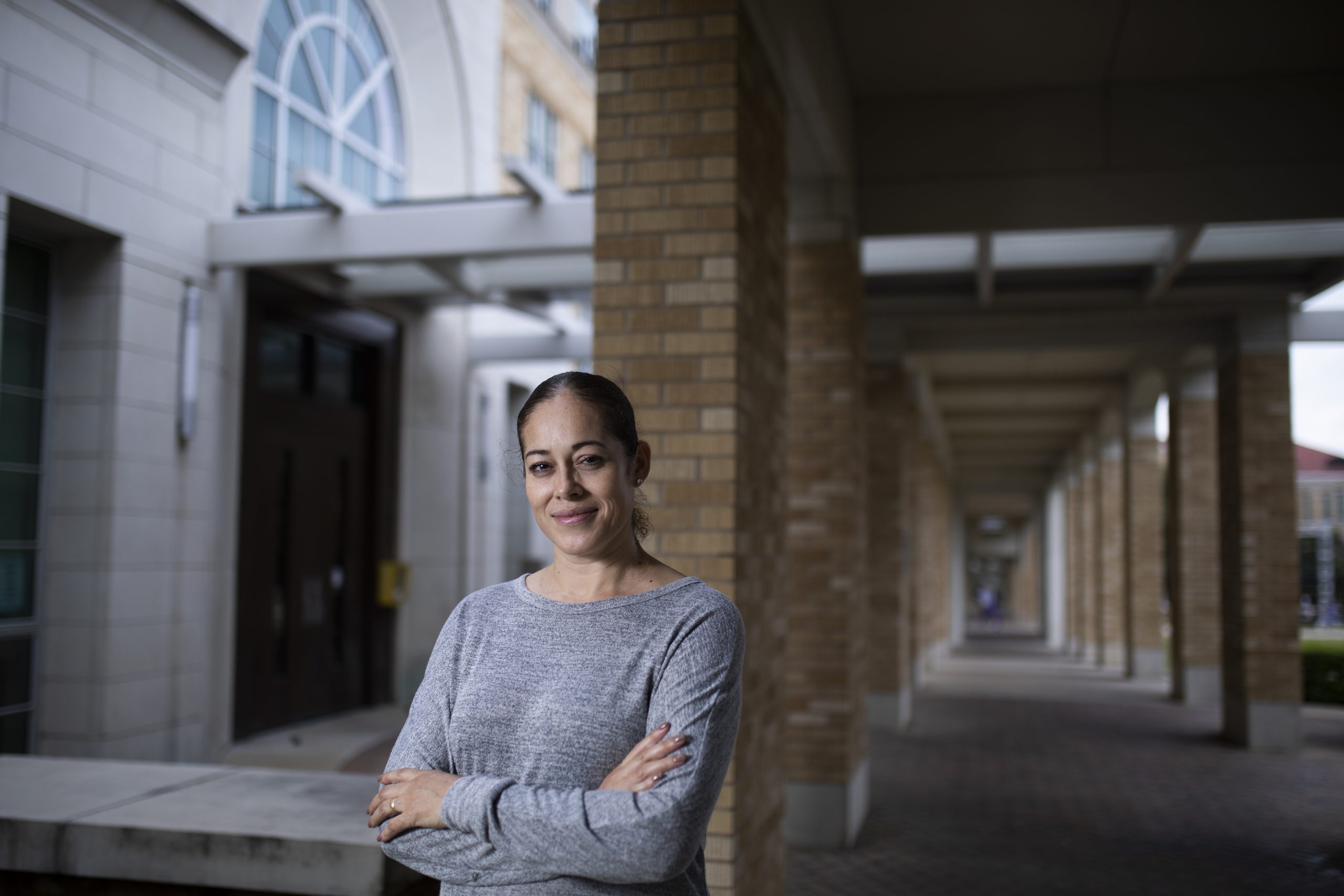 Residential housekeeping service assistant Vicenta Barron is one of several TCU employees who have partnered with students to help each other become more fluent in a second language. Photographed on the TCU campus by Rodger Mallison, November 10, 2021