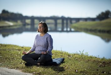 Dr. Shirley Martin, assistant professor of nursing, meditates in Riverside Park by the Trinity River. Martin and fellow Harris College faculty members Ann Johnson, Danielle Walker and Pam Frable were instrumental in establishing the Bebout Wellness Center for the Helping Professions to foster wellness practices among nursing students. Photo by Rodger Mallison, October 30, 2020