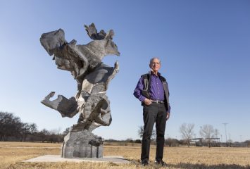 Arnold Gachman, chairman of Gamtex Industries, poses with a sculpture made from scrap metal by artist Mike Ross and welded by Rebecca Low that Gachman donated for display in Fort Worth’s Rockwood Park, Tuesday. Photo made February 15, 2022.