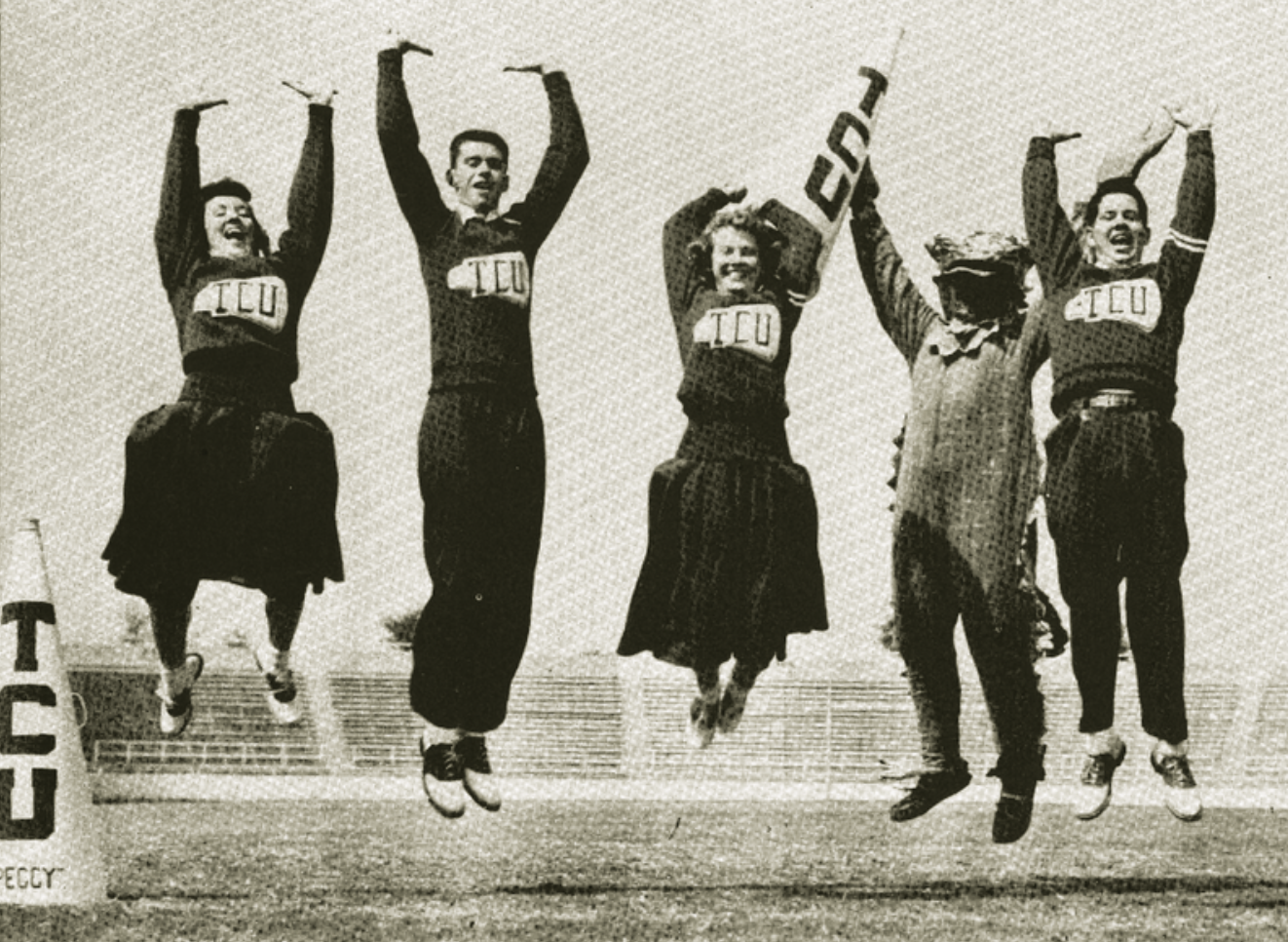 1953 photo of TCU cheerleaders in uniform and Addy the mascot jumping in the air.