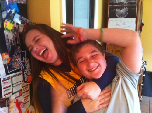 Madi and EJ Ferris, siblings, fight off a headlock