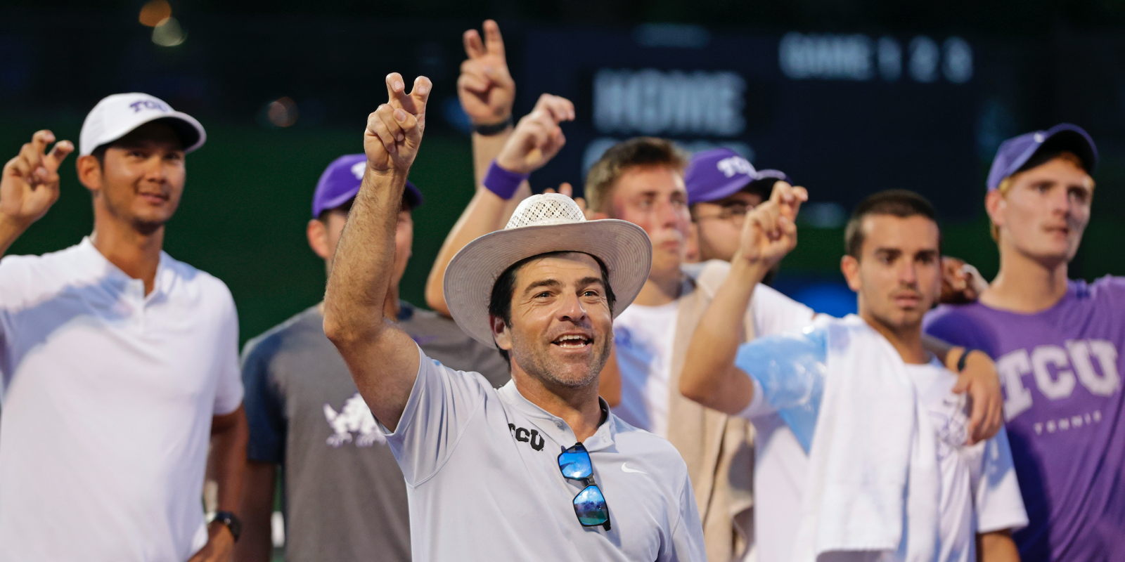 TCU Men's Tennis celebrates its 2022 national indoor title in Seattle with the Go Frogs hand sign