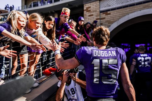 Max Duggan high-fives fan as he leaves the field after TCU beat Texas Tech in 2022.