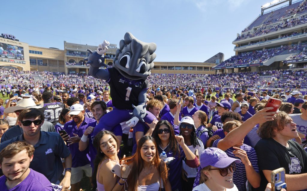 Fans stormed the field after TCU's win over No. 18 Oklahoma in October 2022. The win was the first of four consecutive over ranked opponents, a first in TCU Football history. Courtesy of TCU Athletics | Ellman Photography
