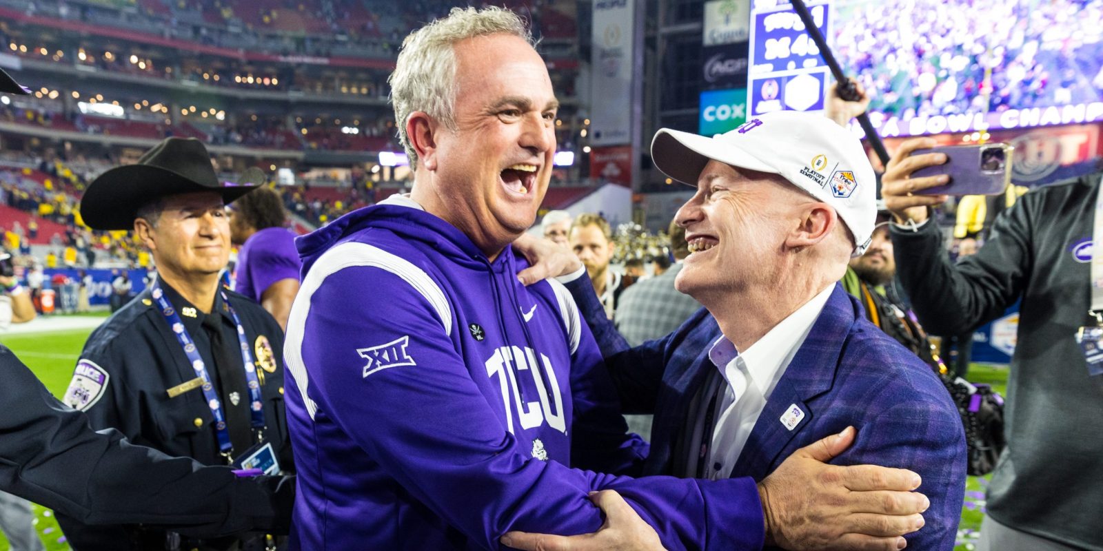 Sonny Dykes and TCU Chancellor Victor J. Boschini, Jr. celebrate after TCU's playoff semifinal win over Michigan on Dec. 31, 2022. Photo by Amy Peterson
