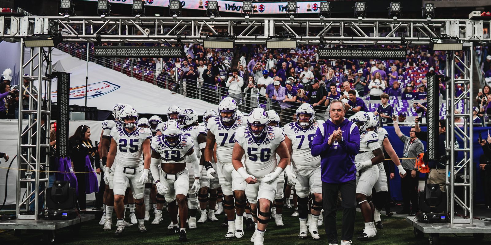 The TCU Football team prepares to take the field at State Farm Stadium in Glendale, Arizona. The Frogs were the first team from Texas to compete in the College Football Playoff. Courtesy of TCU Athletics
