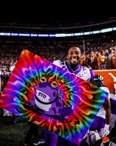 Star Horned Frog receiver Quentin Johnston holds a sign bearing TCU's unofficial mystical mascot, the Hypnotoad. Courtesy of TCU Athletics