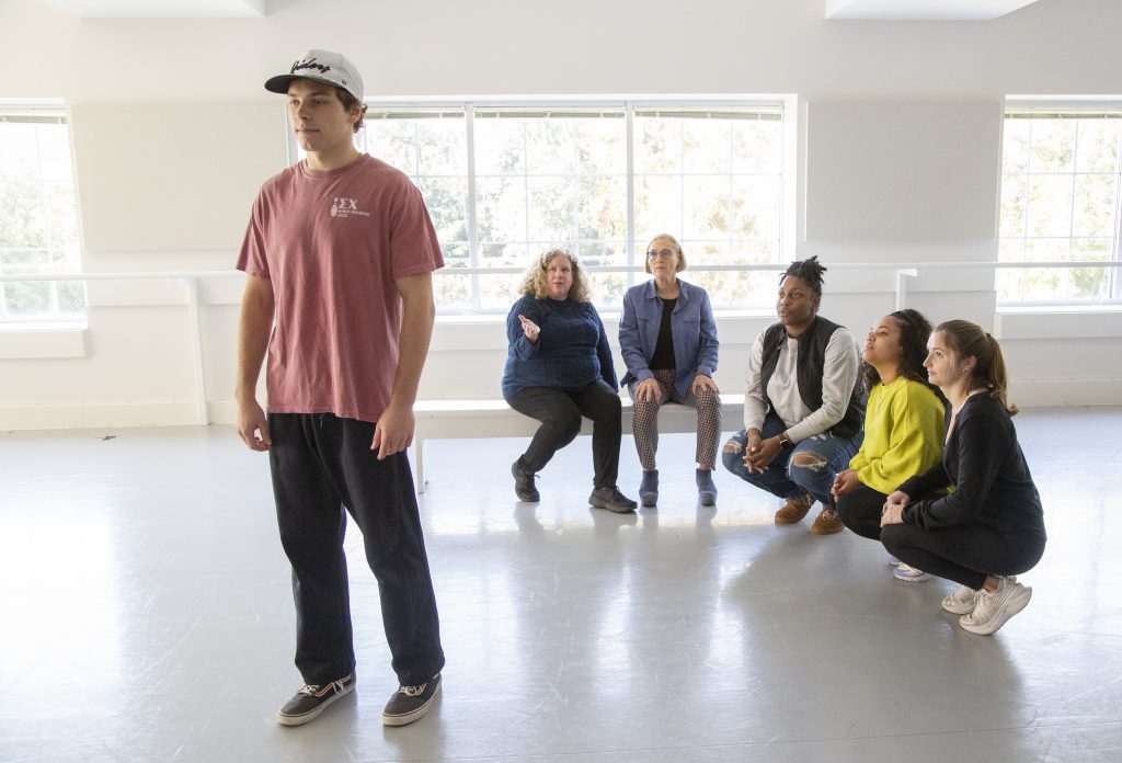 Students in the Team Dynamics management class taught by Tracey Rockett, seated far left, learn how movement can be used as a tool to better understand nonverbal communication.