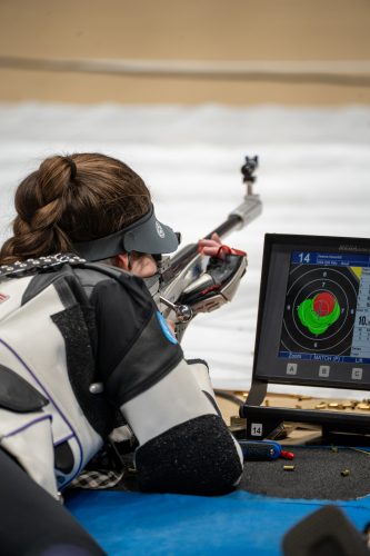 TCU's Jeanne Haverhill, aiming at her target from a prone position, dials in for a shot with her smallbore rifle during Day 1 of the 2024 NCAA Championships in Morgantown, West Virginia.