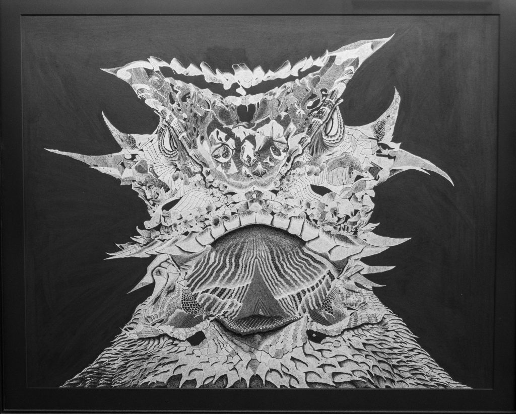 Image of D.J. Perera's white ink on black paper rendering of a horned frog. The piece was created using a technique called stippling, which involves bringing a visual to life through a compilation of dot marks.