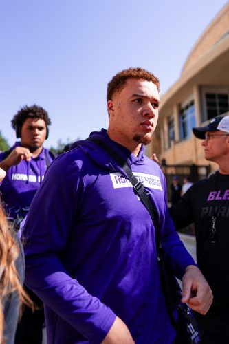 Photograph of TCU football player Devean Deal walking into Amon G. Carter Stadium ahead of an October 2024 college football game between TCU and Texas Tech.