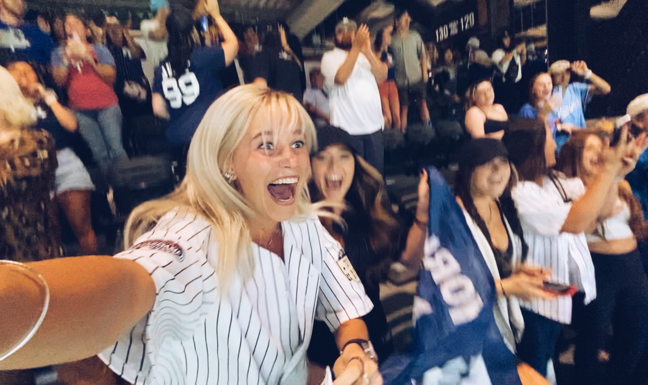 Selfie photograph taken by Ashleigh Scully, as she watches Aaron Judge hit his American League record 62nd home run of the 2022 season.