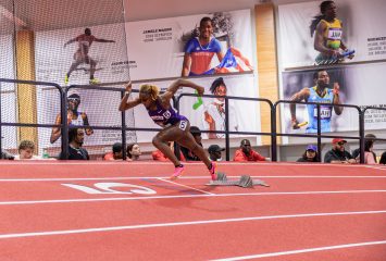 TCU student-athlete Iyana Gray sprints out of the starting blocks during an NCAA Track & Field race.