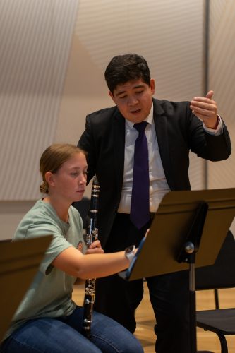 Photograph of TCU doctoral student Diego Torres Reyes teaching a clarinet lesson.