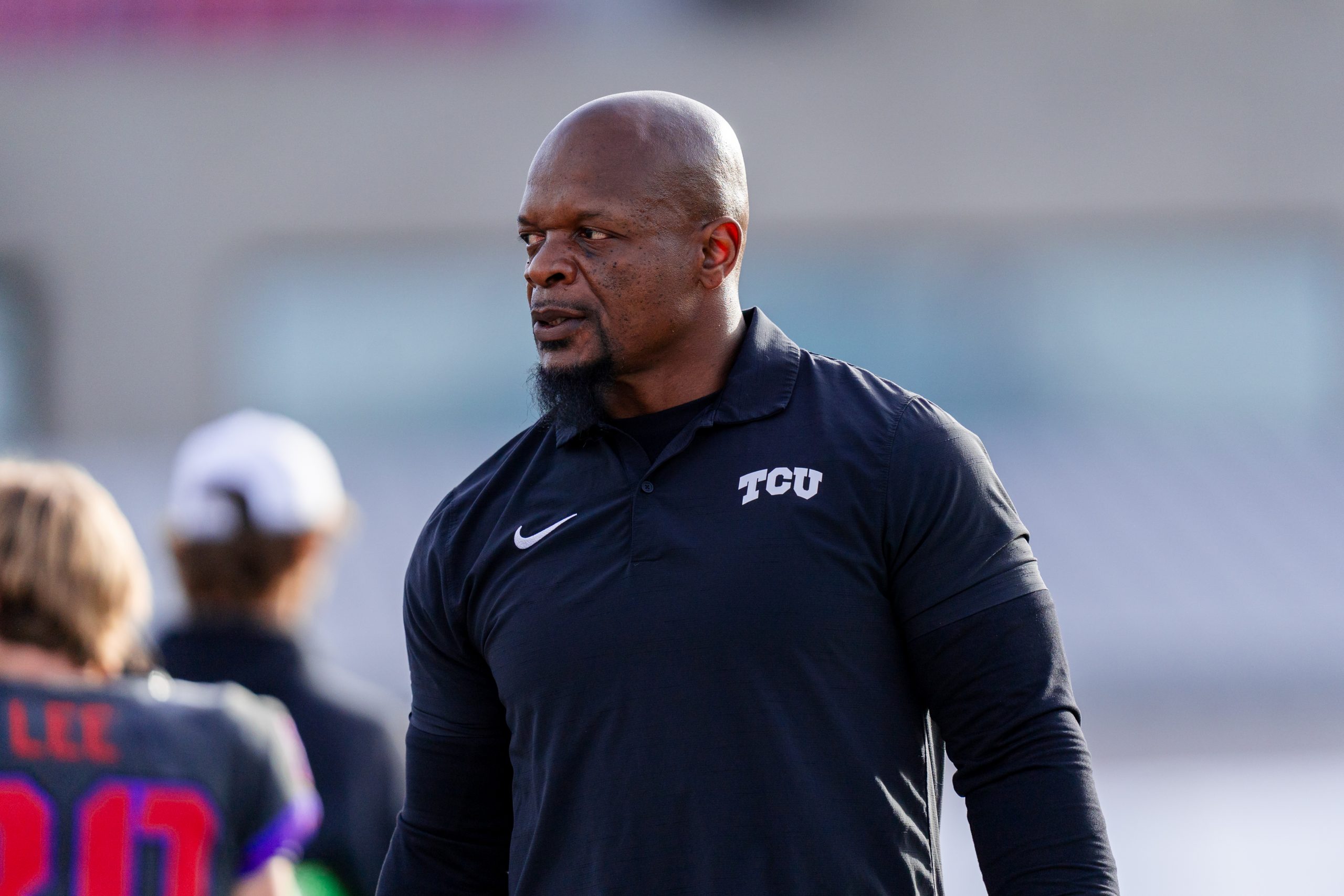 Kaz Kazadi walks on the sunlit field before TCU Football’s 2024 bowl game against Louisiana-Lafayette.