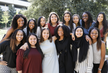 Group photo of smiling mentors and mentees from a Texas Academy of Biomedical Sciences mentoring program pairing TCU undergraduates with high school students.