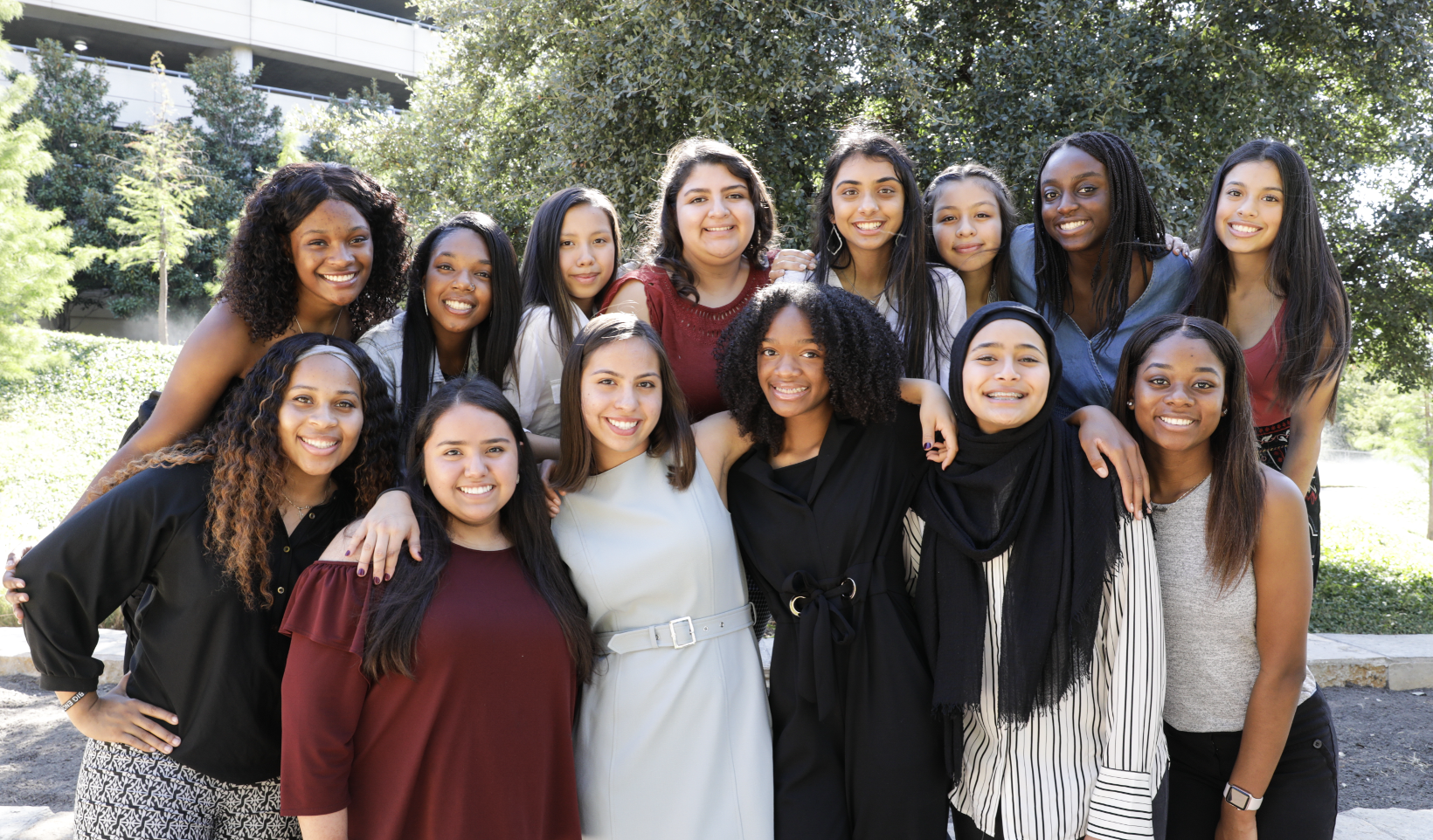 Group photo of smiling mentors and mentees from a Texas Academy of Biomedical Sciences mentoring program pairing TCU undergraduates with high school students.