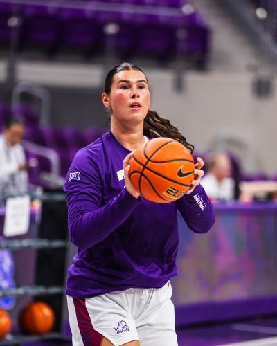 Photograph of TCU forward Natalie Mazurek preparing to shoot a basketball during a pregame warmup at Schollmaier Arena in Fort Worth, Texas, November 2025 NCAA basketball game.
