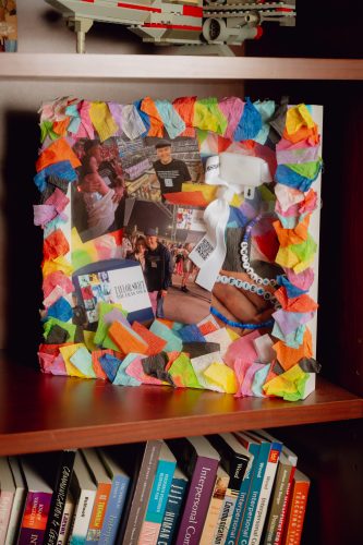 A Taylor Swift-themed display of memorabilia in the office of TCU communication studies professor Andrew Ledbetter, featuring a paper mache frame with photo clippings inside.