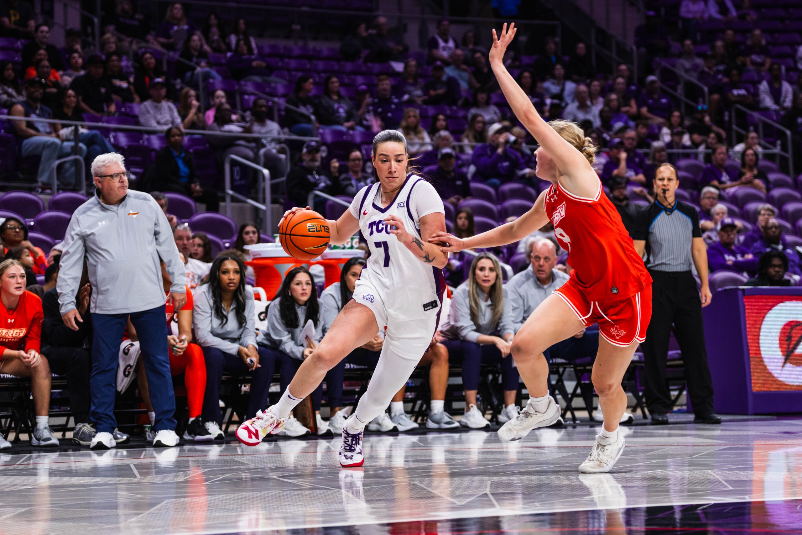 TCU women’s basketball player Marta Suárez driving to the basket against a University of Texas Rio Grande Valley defender during a November 2025 game at Texas Christian University.