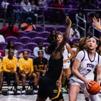 Photograph of TCU basketball player Marta Suárez driving to the basket during a December 2025 home game against Arkansas-Pine Bluff.