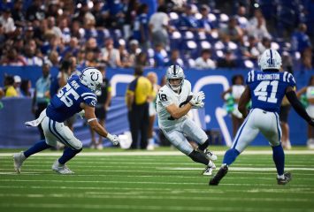 Photograph of NFL wide receiver Jack Bech in a white Las Vegas Raiders uniform (number 18) running with the ball during a 2025 regular-season game, pursued by two Indianapolis Colts defenders in blue uniforms.