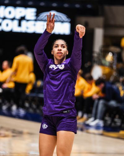 Photograph of TCU women’s basketball player Veronica Sheffey taking a warmup jump shot before a January 2026 NCAA game against the West Virginia Mountaineers.