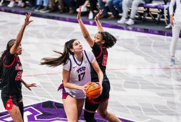 Horned Frogs basketball player Clara Silva, wearing a white No. 17 TCU jersey, attempts a basket during an NCAA game against Houston.