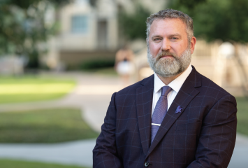 Reuben F. Burch V, TCU"s vice provost for research, standing at the center of the TCU Campus