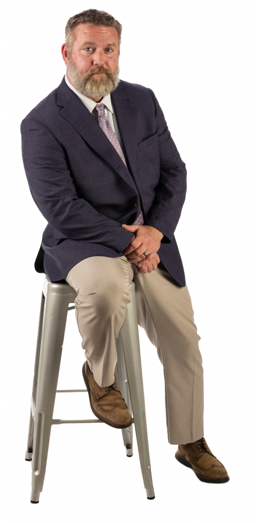 Reuben Burch sitting on a stool