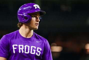 TCU outfielder Chase Brunson in a purple Frogs jersey and batting helmet during a practice or pregame warmup.