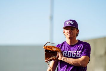 TCU pitcher Lance Davis holds his glove during a Horned Frogs baseball practice or pregame warmup.