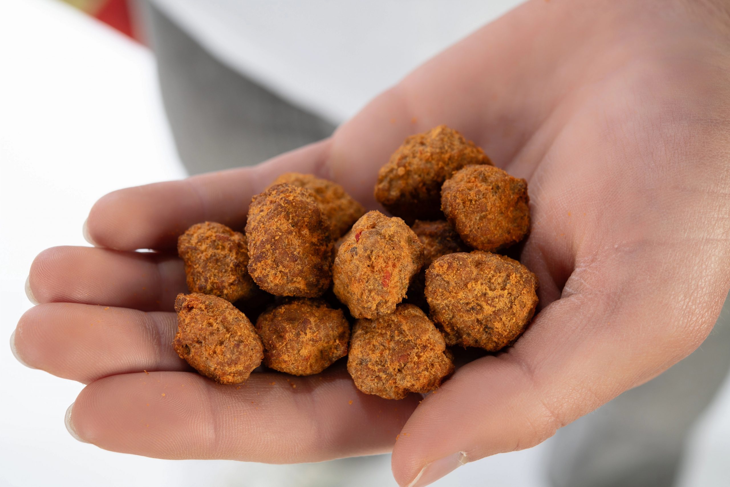 Beckett Kitaen holds Buffs, a grass-fed beef puff snack, during a studio portrait shoot, Feb. 12, 2026.