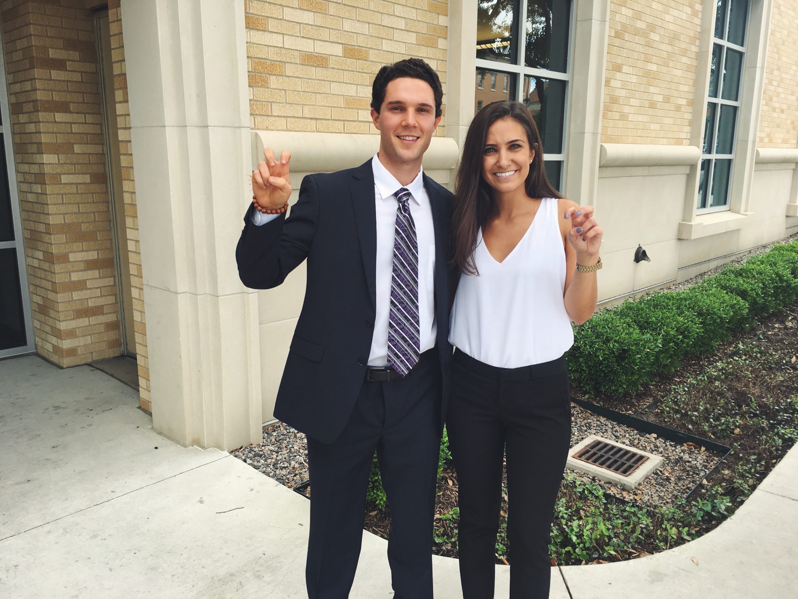 Austin Patry and Sophia Karbowski throw Horned Frog hand signs on the TCU campus in 2017.