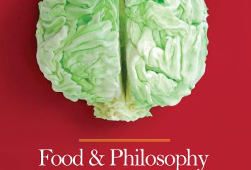 Cover of “Food & Philosophy: Selected Essays” by Spencer K. Wertz, with a halved head of green cabbage resembling a brain on a red background.