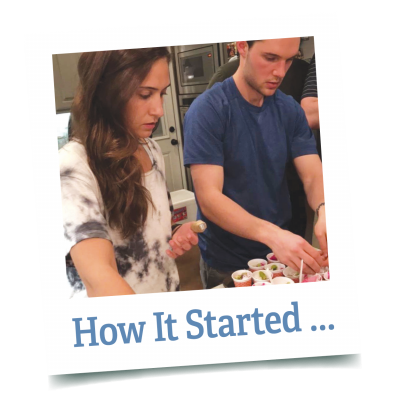 Sophia Karbowski and Austin Patry assemble açaí bowls in a kitchen as college students, shown in a tilted polaroid-style frame captioned “How It Started…”