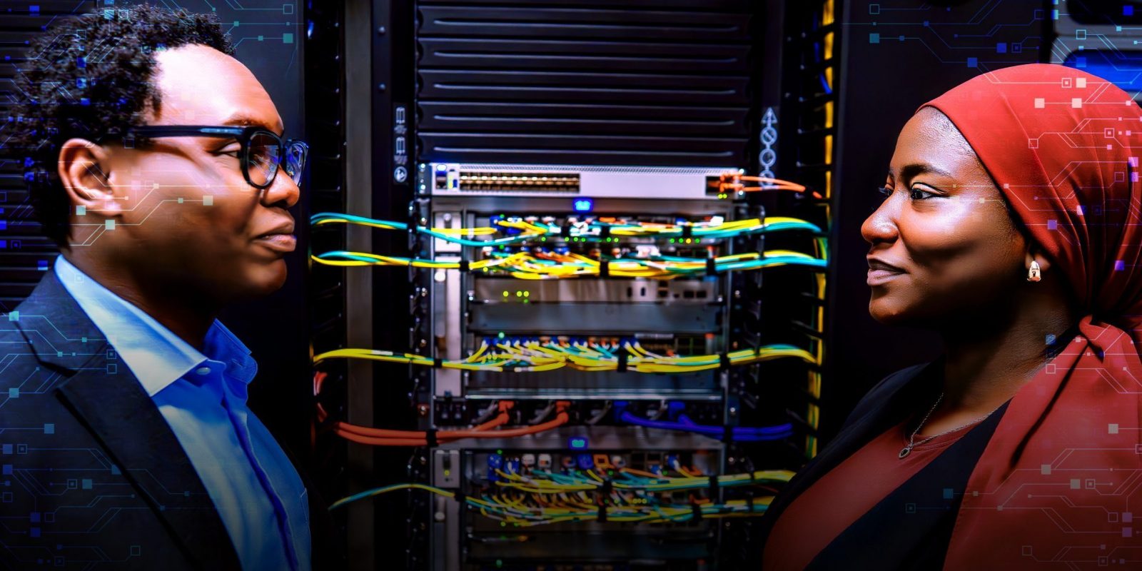 Two people stand facing each other on either side of a server rack filled with colorful network cables, with digital circuitry graphics overlaid across the image.