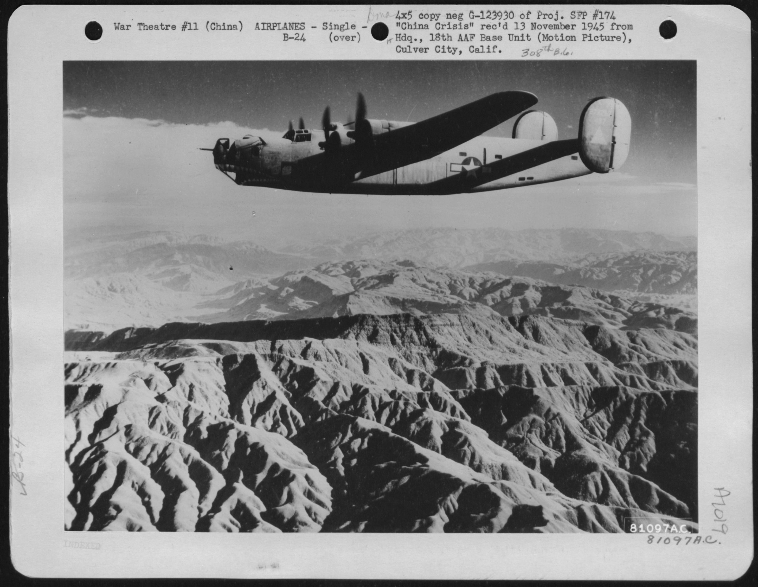 Archival black-and-white print of a propeller airplane with twin tail fins and a star inside a circle on its side, flying above mountains. A typed label across the top reads "War Theatre #11 (China) AIRPLANES - Single - B-24," with additional typed and handwritten notes around the edges.